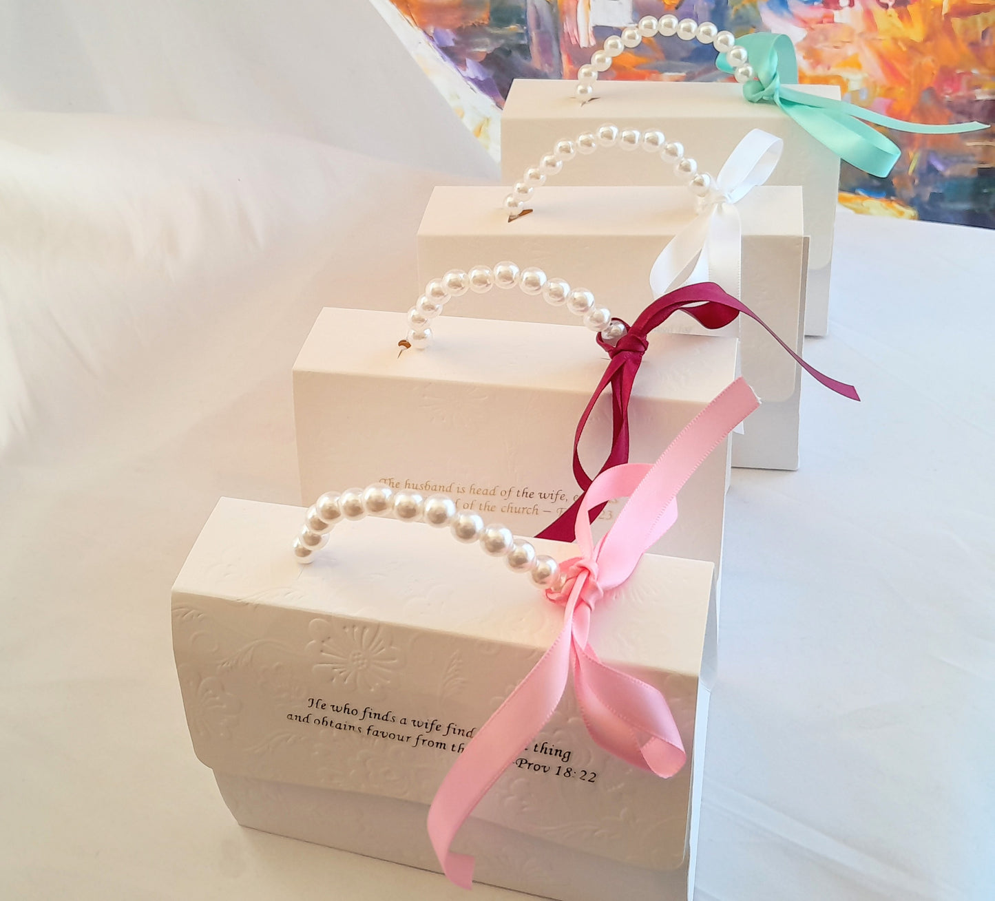 White Embossed  decorative gift box  with pearl handle and different colour ribbons